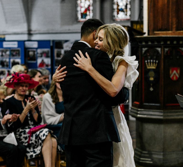 Bride and Groom Embracing During Ceremony