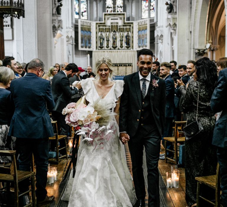 Bride and Groom Exiting the Ceremony as Husband and Wife