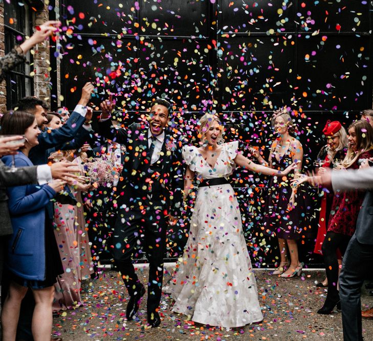 Colourful Confetti Moment with Bride in Ruffle Wedding Dress