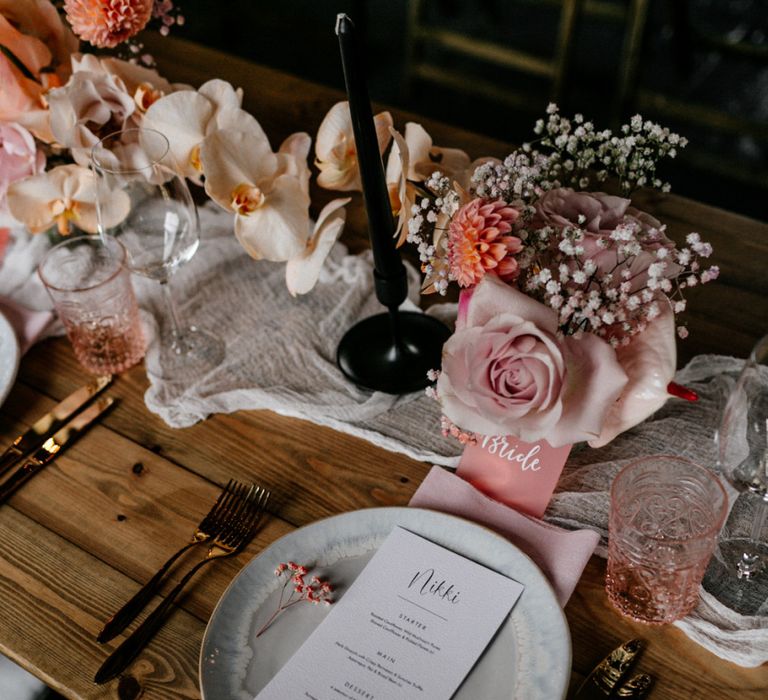 Place Setting with Ornate Plate, Menu Card, and Blush Linen