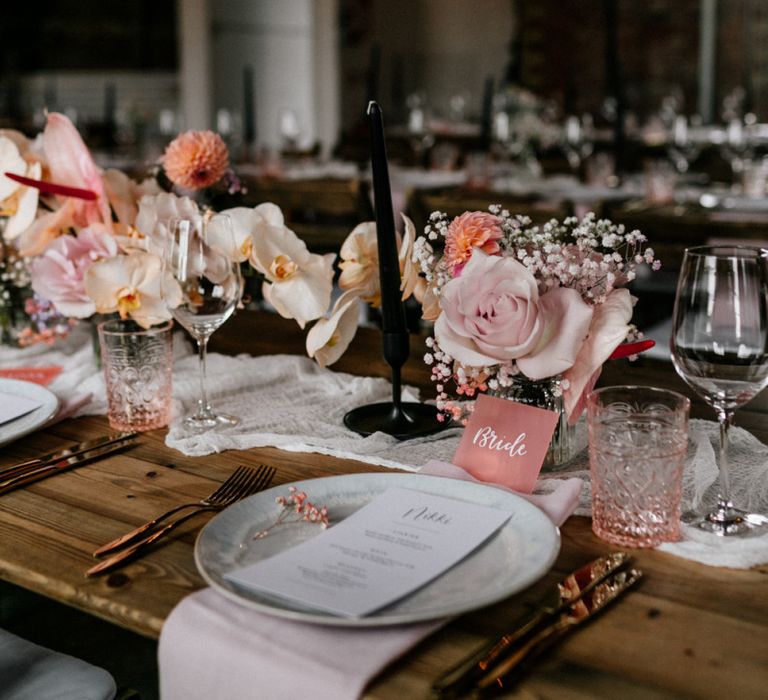 Table Runner with Black Candles, and Blush Flowers including Orchids and Roses