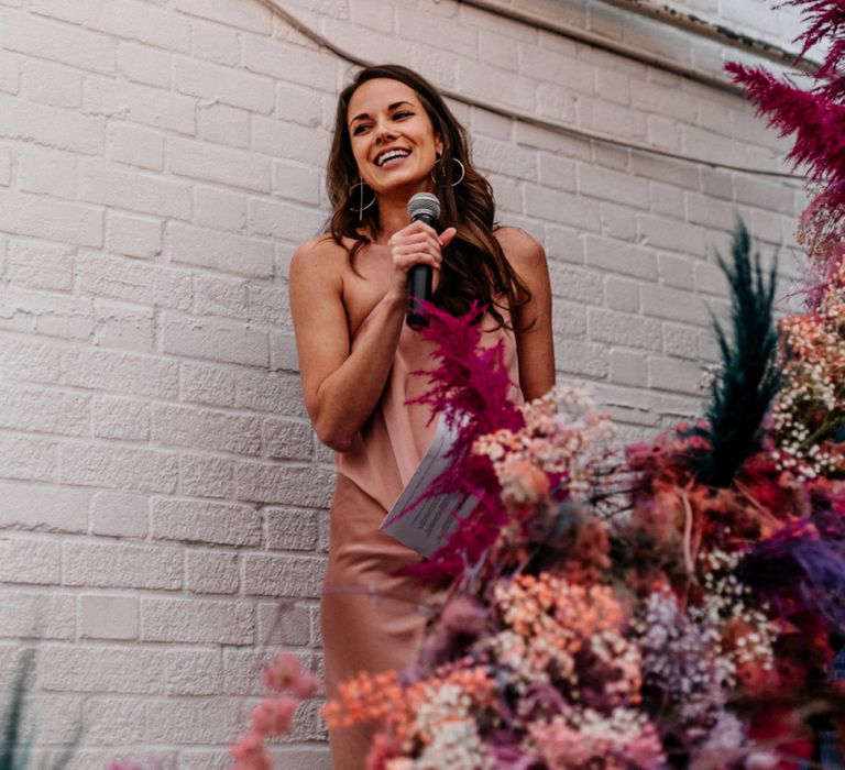 Bridesmaid in Pink Dress Giving a Speech