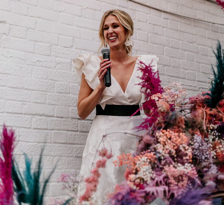 Bride in Ruffle Wedding Dress Giving a Wedding Speech