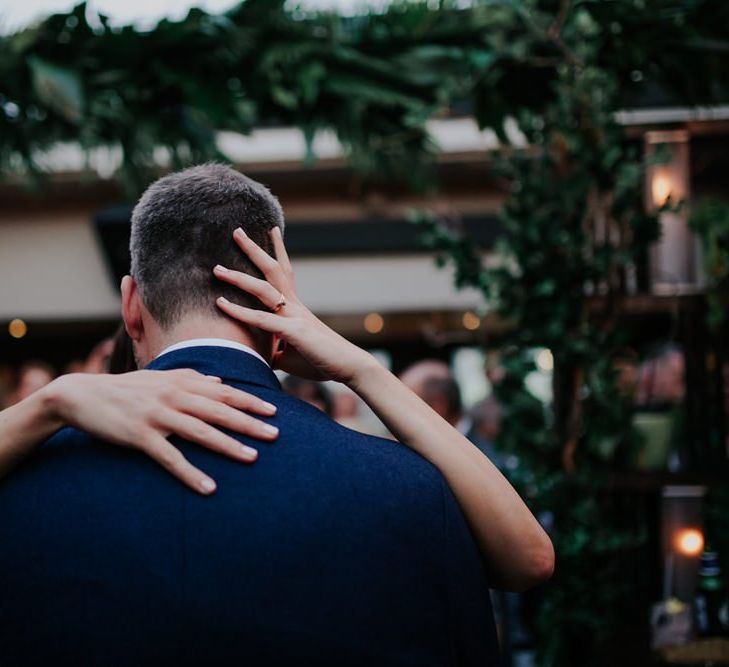 Bride And Groom Kiss On Dancefloor at Wedding Reception