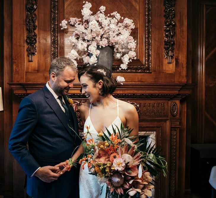 Bride Holding Orange Wedding Flowers Bouquet