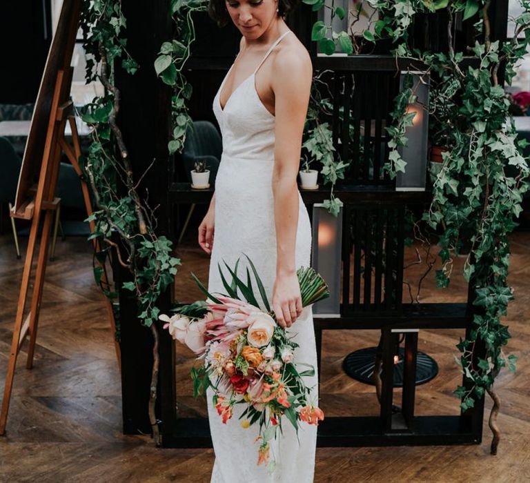 Lace Bridal Dress With Orange Wedding Glowers