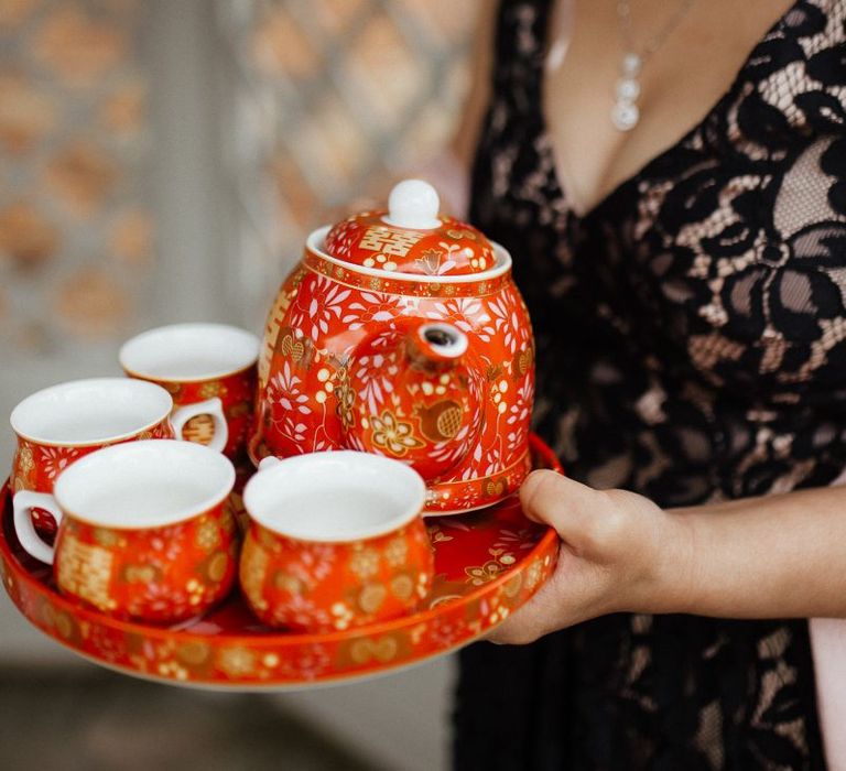 Traditional Chinese tea ceremony for fusion wedding with Indian wedding dress