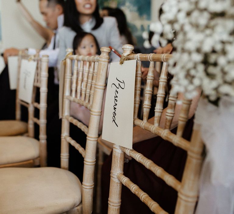 Wedding chairs with flower decor  during ceremony