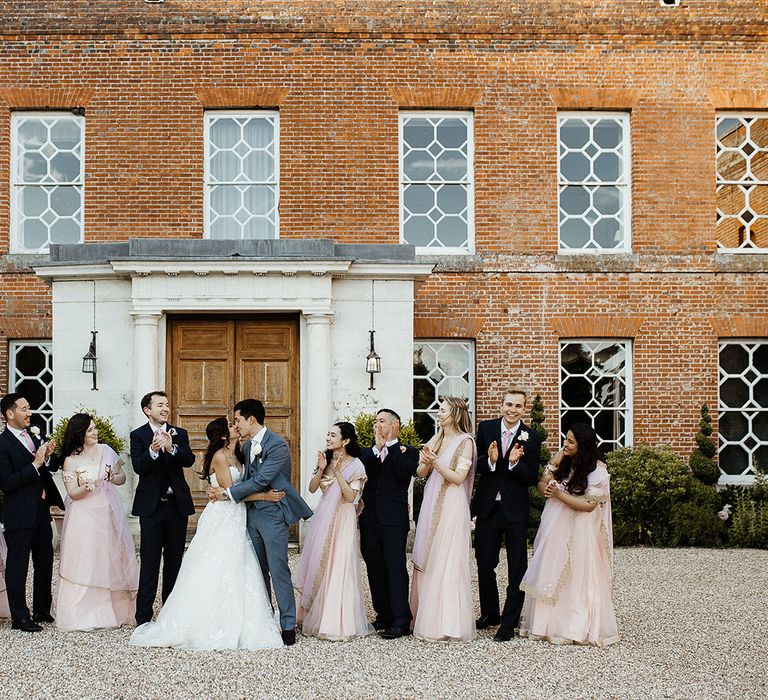 Bridal party and groomsmen with bride and groom