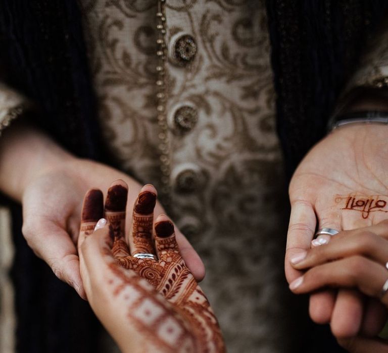 Bridal henna tattoo and navy Indian wedding dress