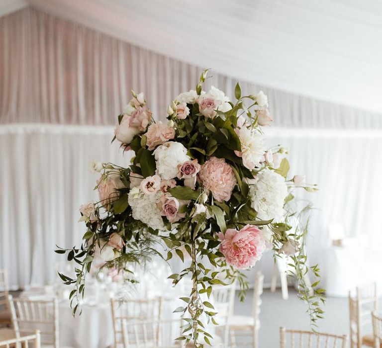 Pink wedding flower centrepieces at fusion wedding