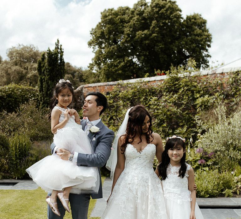 Flower girls with the bride and groom