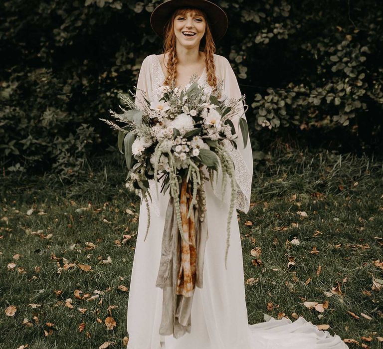 Boho Bride in Lade Wedding Dress &amp; Oversized Bridal Bouquet with Ribbon &amp; Foliage | Nude Bohemian Wedding Inspiration by Wonderland Invites &amp; Rock The Day Styling | Kelsie Low Photography