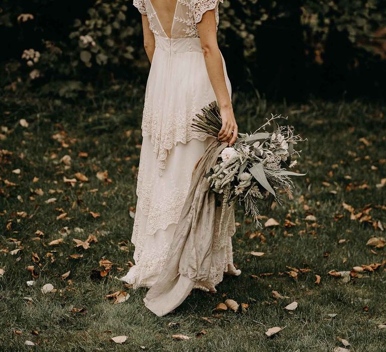 Boho Bride in Lade Wedding Dress &amp; Oversized Bridal Bouquet with Ribbon &amp; Foliage | Nude Bohemian Wedding Inspiration by Wonderland Invites &amp; Rock The Day Styling | Kelsie Low Photography