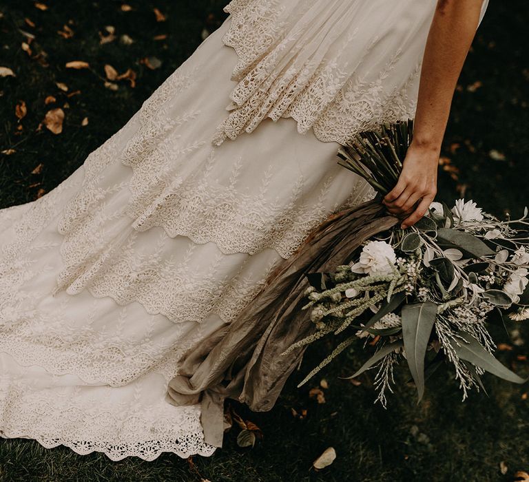 Boho Bride in Lade Wedding Dress &amp; Oversized Bridal Bouquet with Ribbon &amp; Foliage | Nude Bohemian Wedding Inspiration by Wonderland Invites &amp; Rock The Day Styling | Kelsie Low Photography