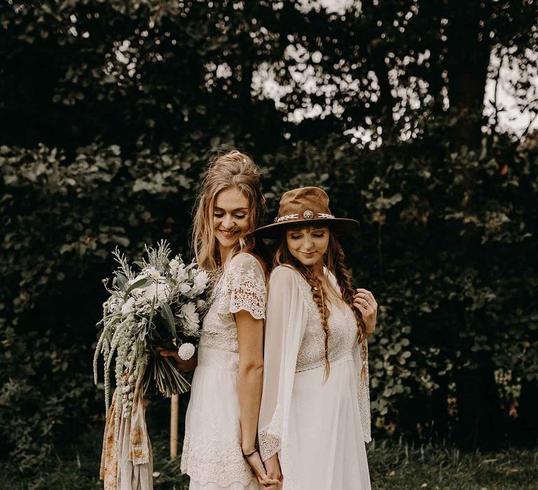 Boho Brides in Lade Wedding Dresses &amp; Oversized Bridal Bouquet with Ribbon &amp; Foliage | Nude Bohemian Wedding Inspiration by Wonderland Invites &amp; Rock The Day Styling | Kelsie Low Photography