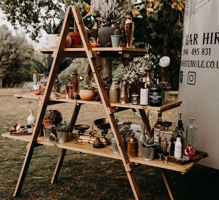 The White Mule Drinks Trailer with vintage Step Ladder Shelving Display | Nude Bohemian Wedding Inspiration by Wonderland Invites &amp; Rock The Day Styling | Kelsie Low Photography