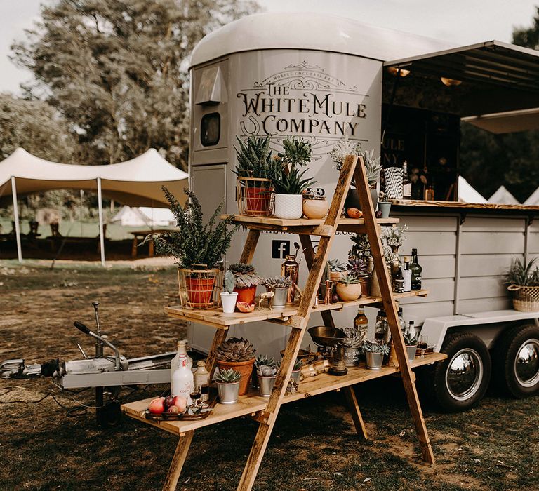 The White Mule Drinks Trailer with vintage Step Ladder Shelving Display | Nude Bohemian Wedding Inspiration by Wonderland Invites &amp; Rock The Day Styling | Kelsie Low Photography