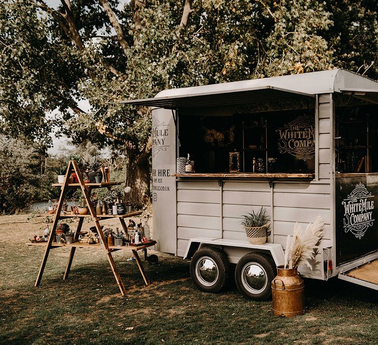 The White Mule Drinks Trailer with vintage Step Ladder Shelving Display | Nude Bohemian Wedding Inspiration by Wonderland Invites &amp; Rock The Day Styling | Kelsie Low Photography