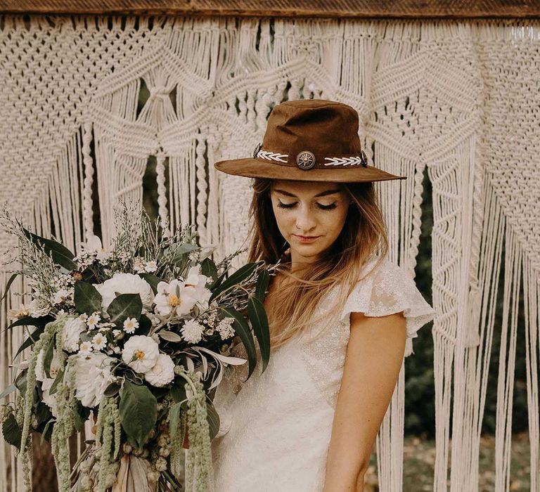 Boho Bride in Hat &amp; Lace Rock The Frock Bridal Gown | Macrame Wall Hanging &amp; Dried Flowers | Nude Bohemian Wedding Inspiration by Wonderland Invites &amp; Rock The Day Styling | Kelsie Low Photography