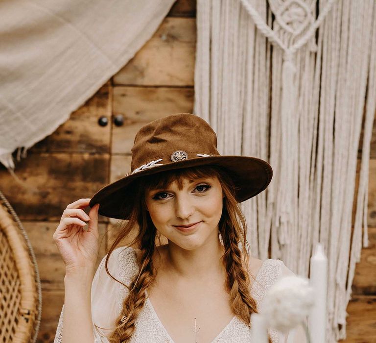 Boho Bride in Lace Dress &amp; Hat | Drapes, Dried Flowers &amp; Macrame Decor | Wooden Table with Candle Sticks &amp; Greenery Garland | Nude Bohemian Wedding Inspiration by Wonderland Invites &amp; Rock The Day Styling | Kelsie Low Photography