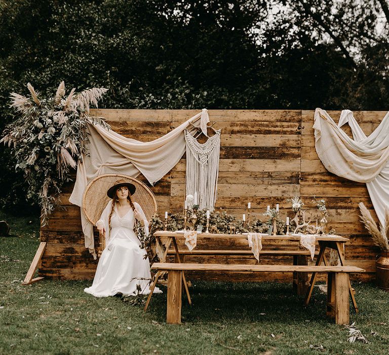 Boho Bride in Lace Wedding Dress | Wooden Backdrop with Drapes, Dried Flowers &amp; Macrame Decor | Wooden Table with Candle Sticks &amp; Greenery Garland | Nude Bohemian Wedding Inspiration by Wonderland Invites &amp; Rock The Day Styling | Kelsie Low Photography