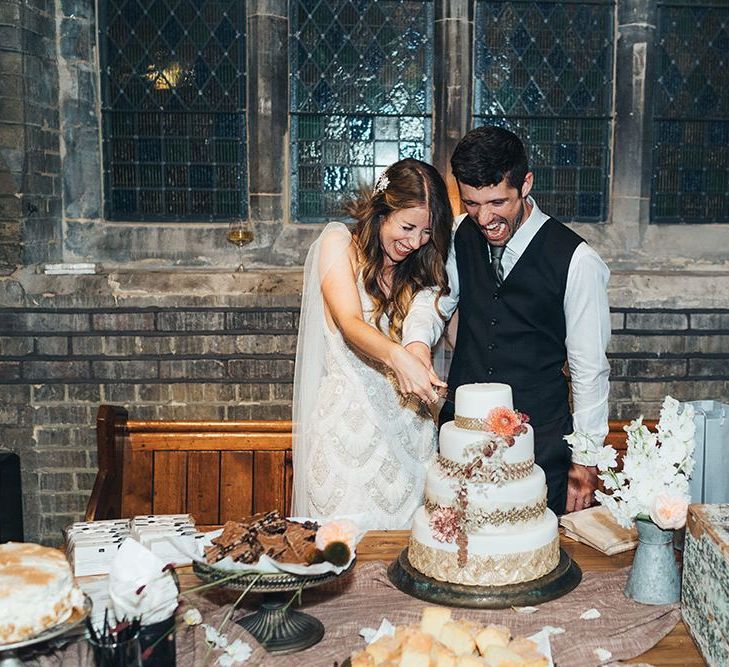 Bride and groom cut the cake at St Stephens Trust wedding reception