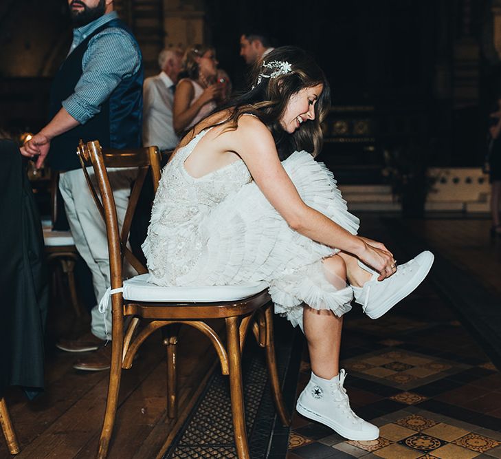 Shoe change into high-top converse for the bride wearing embellished Emma Beaumont dress