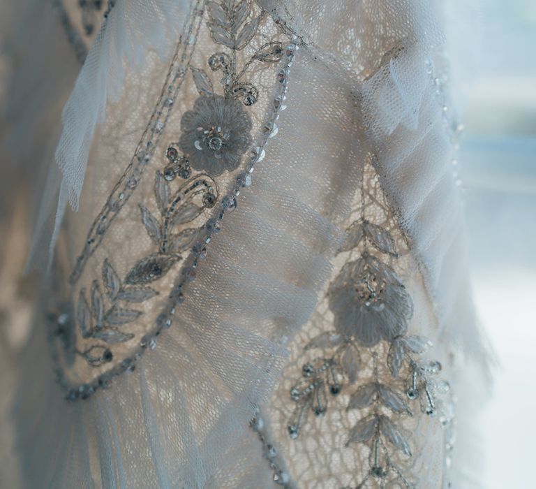 Close up details of embellished custom made Emma Beaumont bridal dress