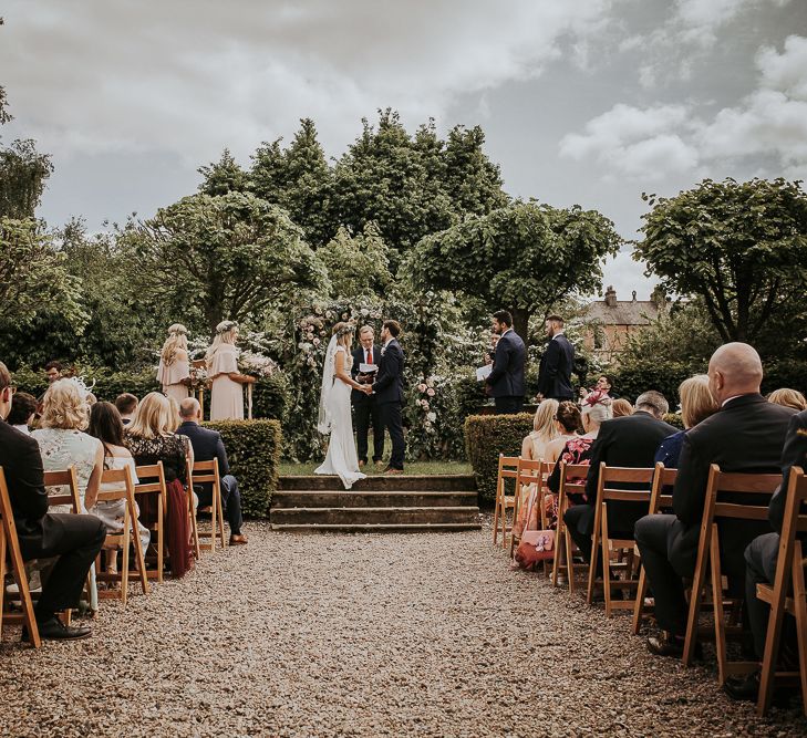 Florals by The Rose Hip and Berry // Blush Pink Boho Barn Vibes With Bride in Rime Arodaky From The White Gallery. Outdoor ceremony at Larchfield Estate in Northern Ireland. Photography by Ten Twenty One.