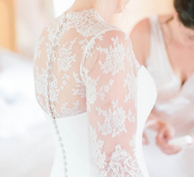 Bride in Lace Bolero over Suzanne Neville Wedding Dress with Chic Bridal Up Do