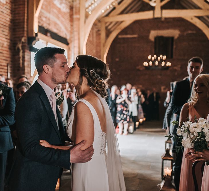 The Ceremony | Kiss | Blush Pink and Copper | RMW The List Members Hazel Gap Barn, Nottinghamshire | Mikaella Bridal Gown | Pear and Bear Photography