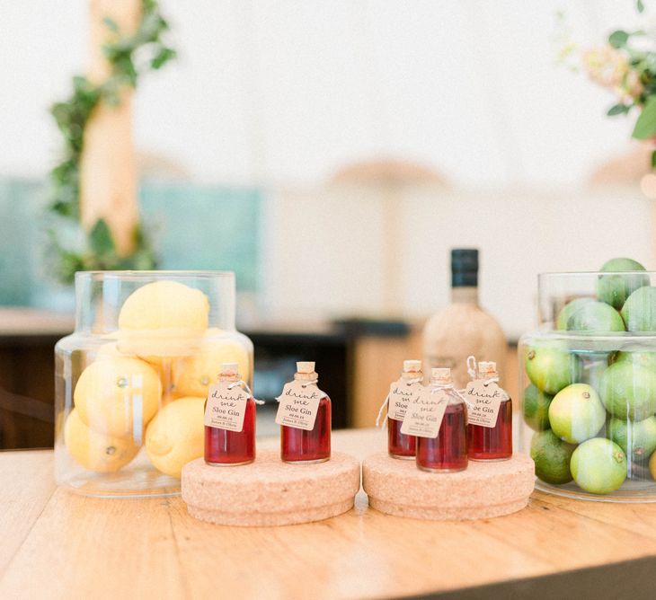 Glass Jars Filled with Oranges and Limes and Miniature Alcohol Wedding Favours