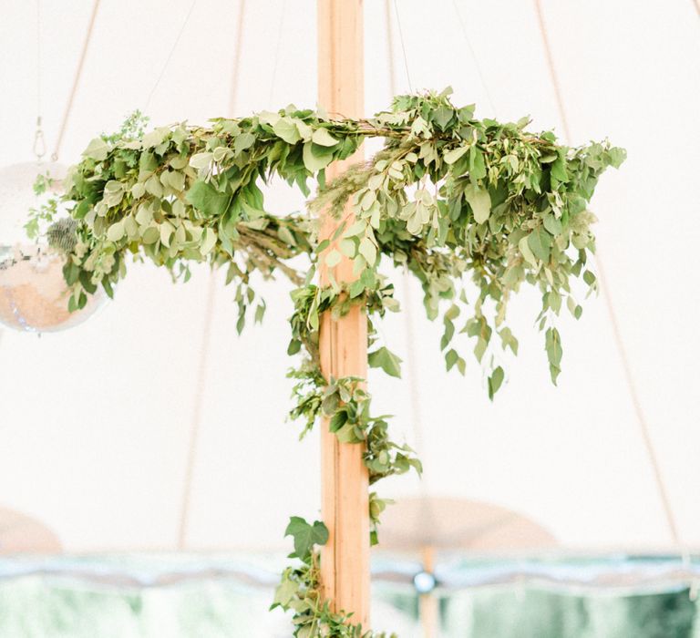 Foliage Hoop Chandeliers and Foliage Wrapped Around Poles