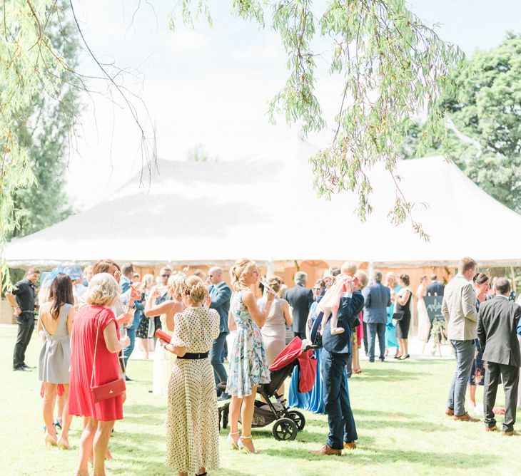 Wedding Guests Enjoying the Sunshine at an Outdoor Wedding