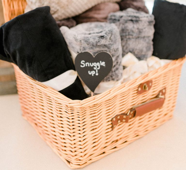 Wicker Basket Filled with Blankets to Snuggle Up