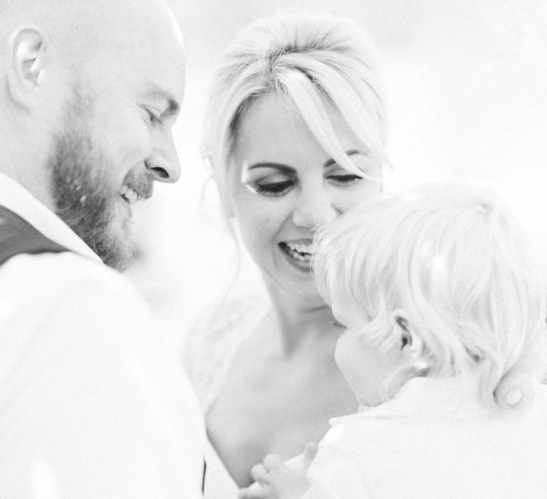 Black and White Family Portrait of Father, Mother and Son