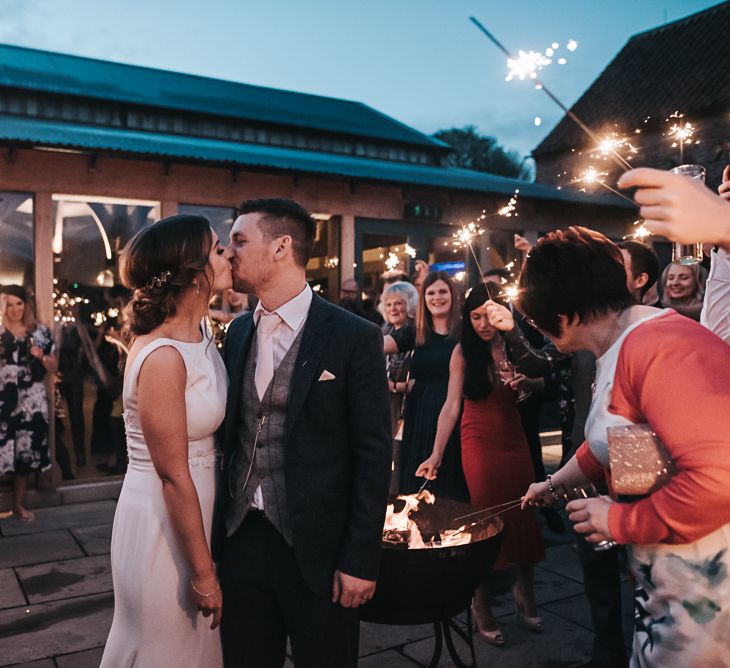 Sparklers on exit | Blush Pink and Copper | RMW The List Members Hazel Gap Barn, Nottinghamshire | Mikaella Bridal Gown | Pear and Bear Photography