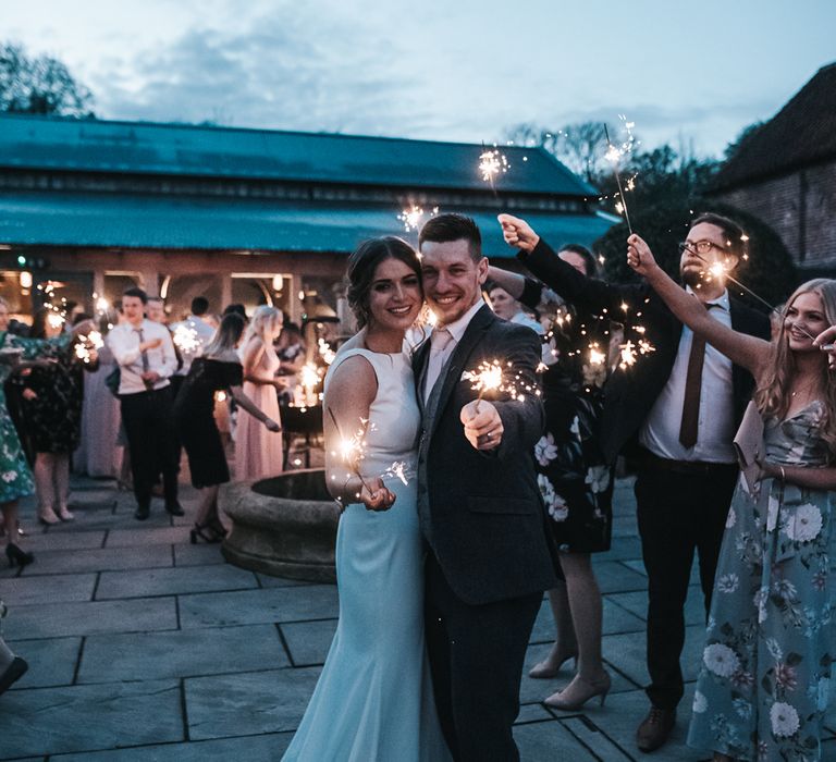 Sparklers on exit | Blush Pink and Copper | RMW The List Members Hazel Gap Barn, Nottinghamshire | Mikaella Bridal Gown | Pear and Bear Photography