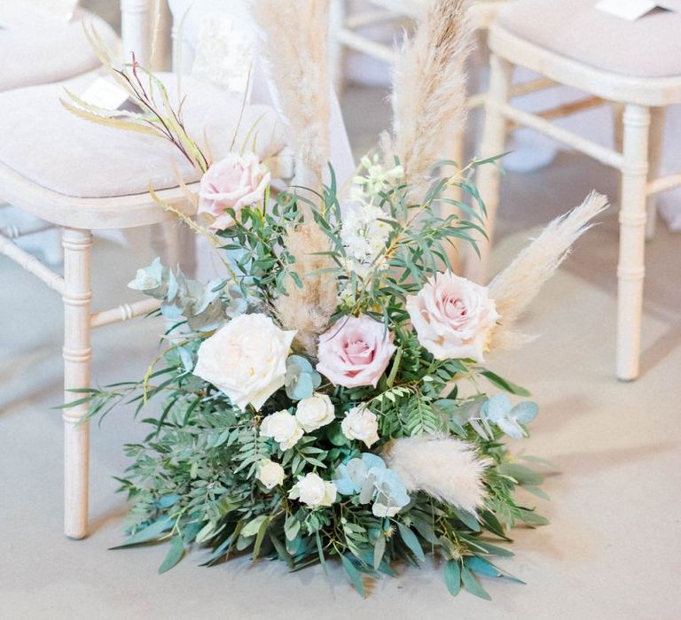 Wedding flowers and pampas grass decor for ceremony