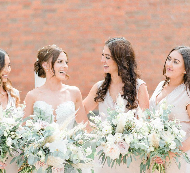 Bridal party bouquets with blush roses and pampas grass