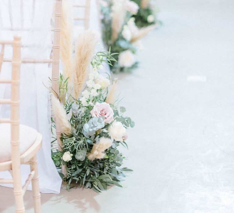 Wedding aisle flowers and decor