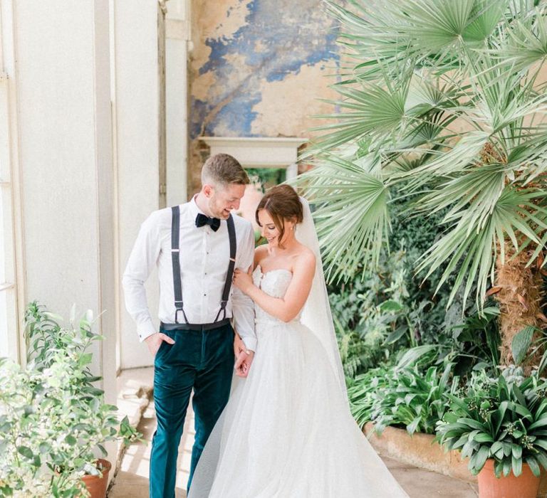 Bride in detachable skirt wedding dress with groom