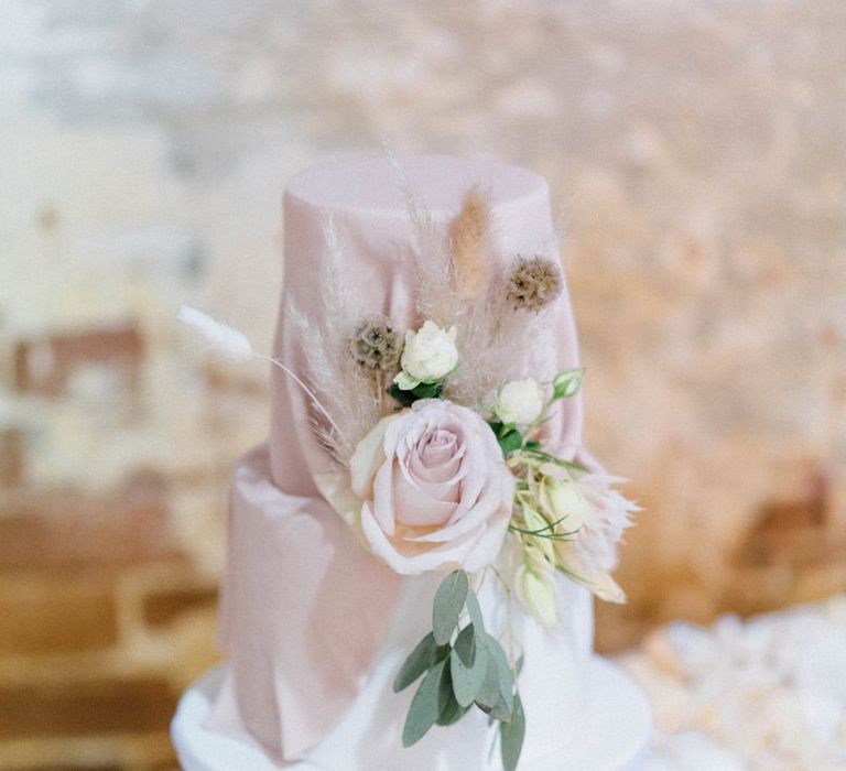 Blush wedding cake with rose flowers