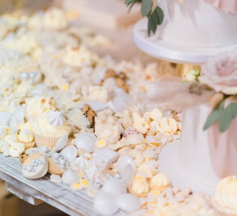 Sweet table with blush wedding cake