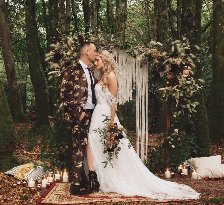 Groom in Brown Patterned Suit and Bride  Cold Shoulder Wedding Dress with Fringe Detail