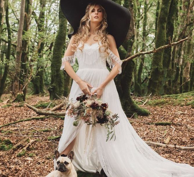 Boho Bride in Lace Wedding Dress with Giant Hat and Pet Pug