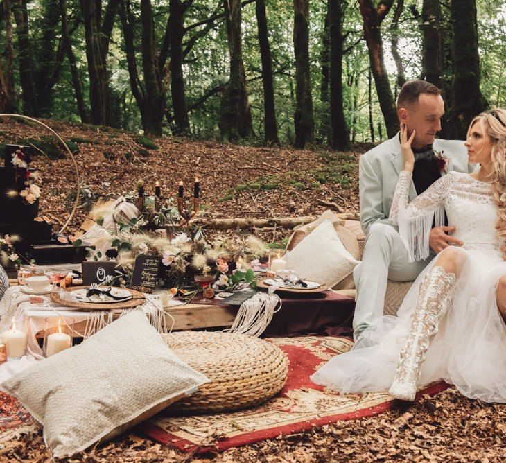 Bride in Long Sleeve Wedding Dress with Fringe Detail and White Lace Boots