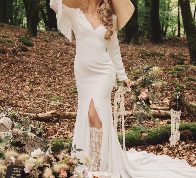 Bride in Fitted Wedding Dress with Fringe Detail and Giant Straw Hat