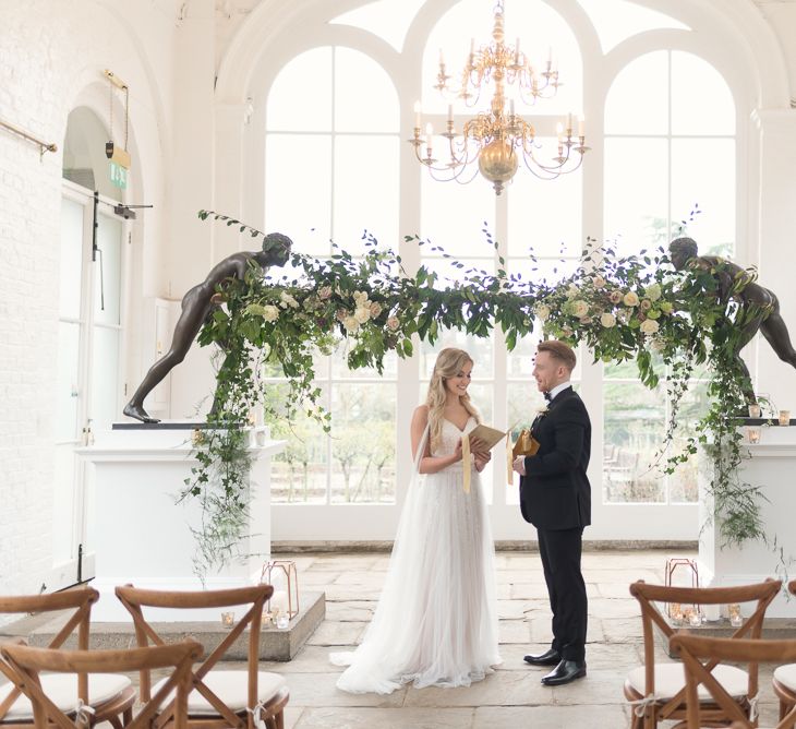 Altar Floral Installation | Bride in Nissa Now  from Chic Nostalgia | Groom in Black Tie Suit | Super Luxe White, Grey &amp; Gold Elegant Wedding Inspiration at Orangery, Holland Park, Kensington, London | Planned &amp; Style day The Events Designers | Eva Tarnok Photography